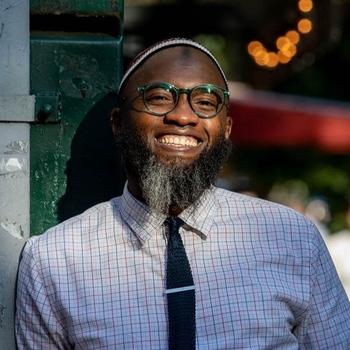 Dr. Walkens Petit-Frere smiling outdoors